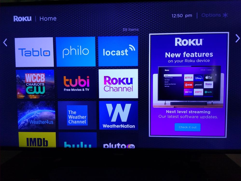 Home screen showing "New Features" advertisement video link.